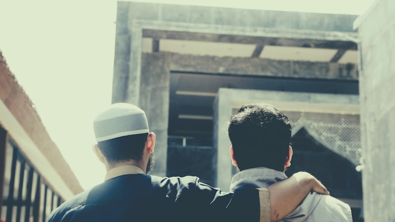 Two people reviewing a property together during a roofing consultation.